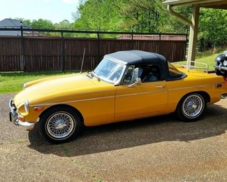 This is a 1973 MGB.  It has new spoke wheels.   Also included is a hard top and a new soft top.