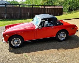 This is a 1972 MG Midget.  It also has new spoke wheels.