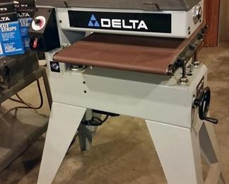 Delta 31-250 drum sander includes 5 extra rolls of sandpaper.  The family says Dr. Lawler never used it.
