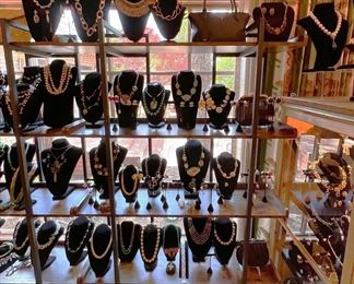 Costume and fine sterling jewelry; designer handbags