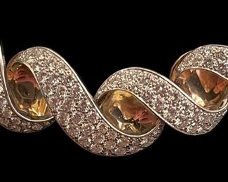 Closeup of workmanship on 18k spiral diamond necklace