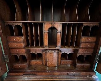 Early 19th Century double bonnet fitted secretary with secret drawers and cubbyholes