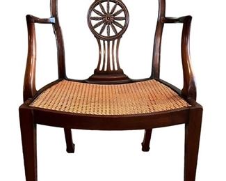 Antique carved cane bottom armchair