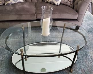 Stylish brass and glass oval double tiered coffee table