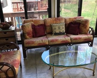 Matching rattan couch, beveled glass over brass coffee table!