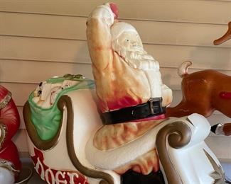 Santa in Noel sleigh Blow mold. Has some cracks and missing piece of ball on hat. $ 65.00