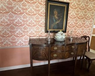 Hepplewhite-style mahogany sideboard with brass gallery, terminating in tapered legs.