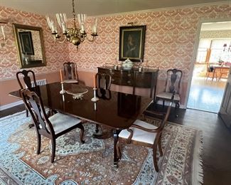 Hepplewhite style Double Pedestal and Mahogany dining room table, clean and style mahogany chairs.