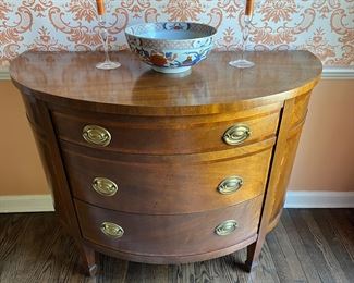 BAKER Hepplewhite-style mahogany demilune, three drawer serving cabinet spade feet.