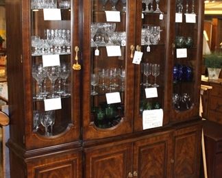 Beautiful Henredon china cabinet shown with lots of quality stemware.  The cabinet is seven feet high and six feet wide.  
