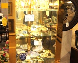 We have a pair of these brass and glass corner display cabinets.  They are stunning.  