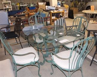 Hooker glass top iron base table and four chairs.  This set  would work well both outdoors or in.  