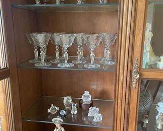 Swarovski figurines; crystal decanter; nice selection of crystal drinkware.