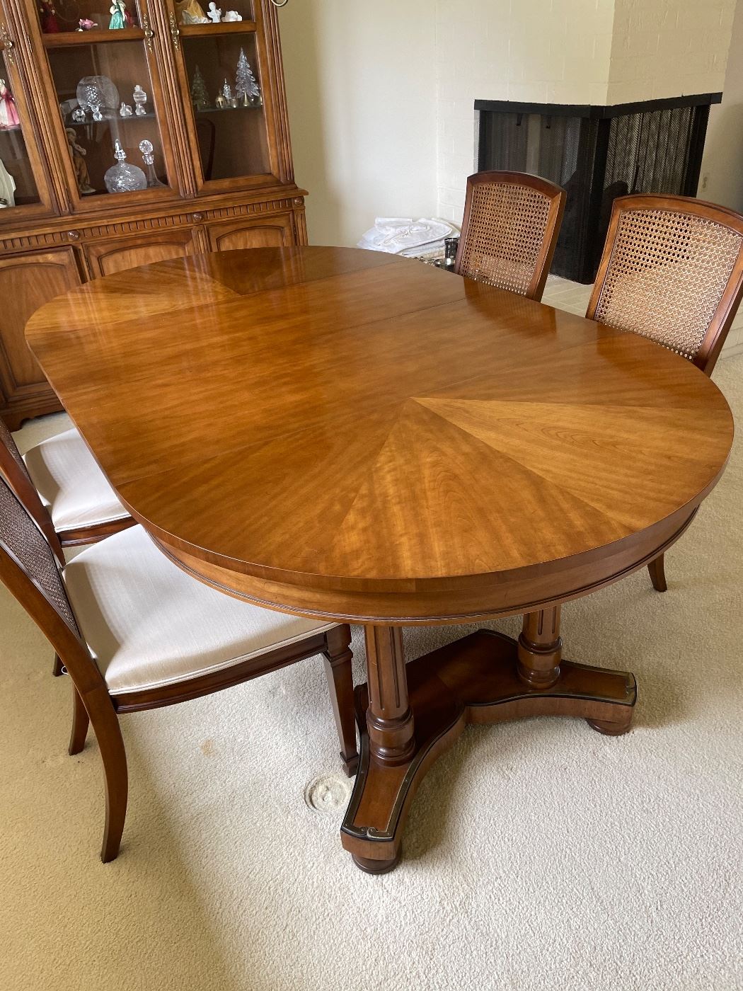 Kindel “Borghese” dining table with three leaves, six chairs, and pads.