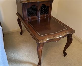 One of two matching vintage accent tables.