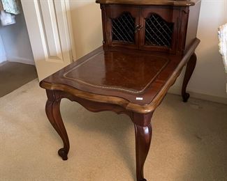 One of two matching vintage accent tables.