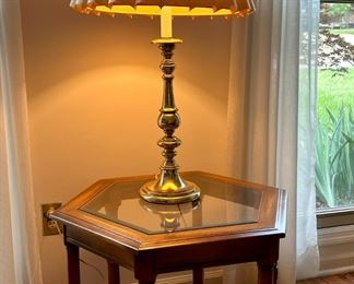 Glass top table and brass lamp