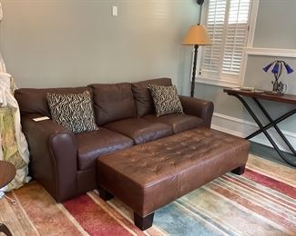 McCeary Modern three cushion Leather Sofa. Restoration Hardware leather ottoman.