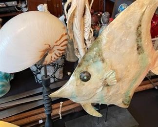 Fish on stand and shell on stand.