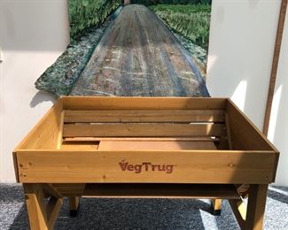 Veg Trug with an interesting Landscape with Road oil painting behind it