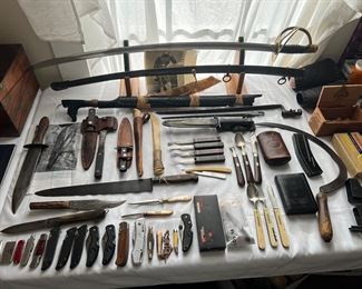 Table full of Civil War items and knives 