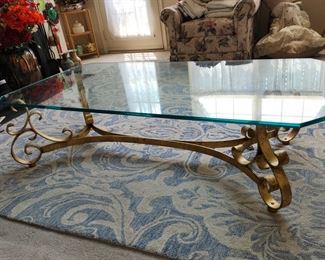 glass and gold coffee table, has 3 matching round end tables