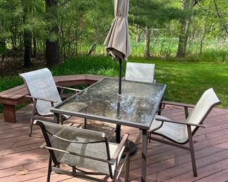 Outdoor table, chairs, and umbrella