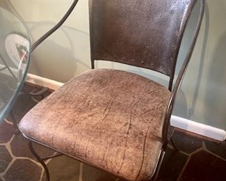 Industrial-style metal and glass breakfast table and four chairs