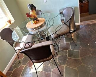 Industrial-style metal and glass breakfast table and four chairs