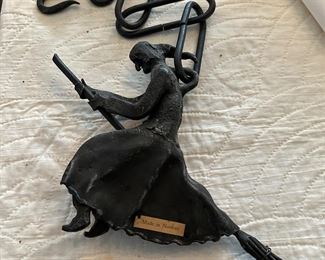 Cast iron witch on broom gate weight