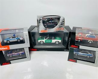 
Six Schuco Die Cast Metal Scale Model Police Cars in Original Boxes - Porsche Carrera 911 Polizei, Alfa Romeo 156 GTA, BMW 525i Polizei, Porsche 914 Polizei and More