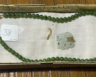 14K yellow gold clasp jade bead necklace and pale jade and gold elephant pendent
