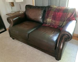 Matching brown Leather loveseat from Walter E. Smithe. 8' x 10' Calvin Klein area rug