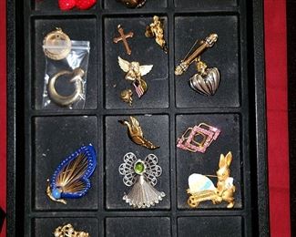 Brooches and pendants.
