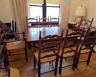 Colby furniture. Expandable dining room table with eight ladderback chairs.