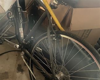 a bike buried in the garage... the garage is a pickers paradise! (or nightmare!)