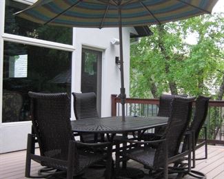 Wonderful Tropitone outdoor furniture, and a Weber Genesis Grill