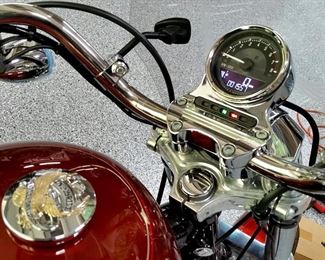 The Harley Davidson motorcycle only has 1,557 miles on it.