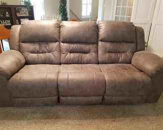 Large leather sofa with reclining end sections
