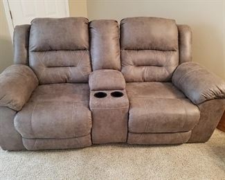 Leather loveseat with reclining sections