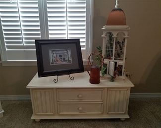 Assorted decor on painted cedar-lined blanket chest