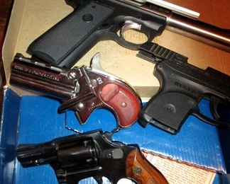 Ruger MK III 22/ 45    .22 cal with laser site, Cobra of Utah Derringer Type.