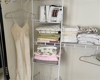 Linens:  sheets, window panels, and vintage footstool, and silk nightgown