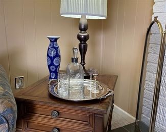 Drexel Heritage side table with bronze lamp, silver-plated tray with handles, decanter and aperitif glasses; ceramic vase