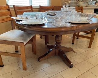 Kitchen pedestal table with a leaf - shown in with 4 side chairs; crystal and glass serving pieces