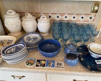Staffordshire dishes, Italian platters, Dansk cream and sugar set, blue glassware, canister set, and greek tiles