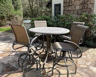 Patio high table with four swivel armchairs