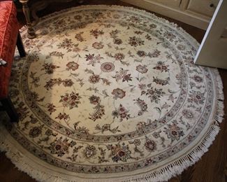 Round hand woven area rug