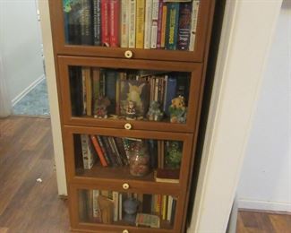 4 tier modern book/whatnot shelf. Glass fronts.