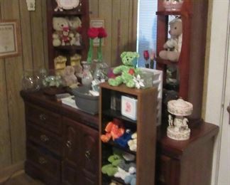 Mirrored dresser and lots of stuffed collectibles.